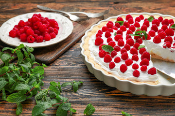 Tasty raspberry pie on wooden background