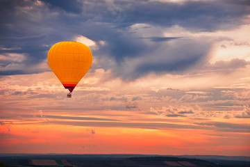 Hot Air Baloon Flying with Beautiful Colorful Dramatic Sky at Sunset - obrazy, fototapety, plakaty