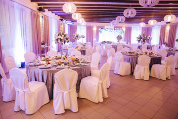 Element of decor in restaurant. Decoration on wedding. A chic tables in restaurant