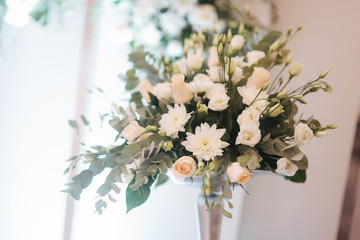 Flowers on the wedding table in restaurant
