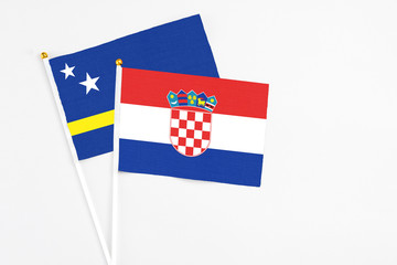 Croatia and Curacao stick flags on white background. High quality fabric, miniature national flag....