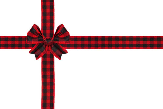 Red and black buffalo plaid Christmas gift bow and ribbon arranged as wrapped gift box isolated on a white background