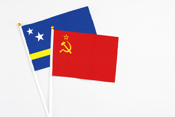 Soviet Union and Curacao stick flags on white background. High quality fabric, miniature national flag. Peaceful global concept.White floor for copy space.