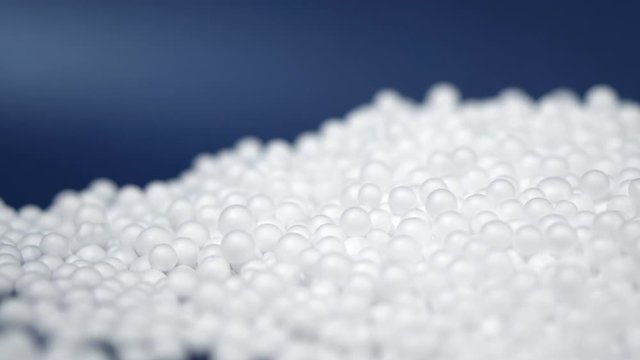 White round polystyrene packaging material in pan shot, modern foam bead ball decoration cause global warming from chemical waste