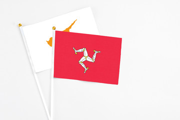 Isle Of Man and Cyprus stick flags on white background. High quality fabric, miniature national...