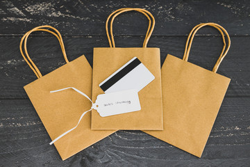 seller's success concept, group of shopping bags with payment card and price tag with Sales Strategy text on one of them