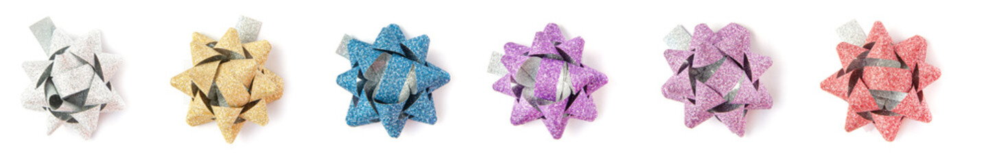 Top view banner of many gift bow red, blue, silver, yellow,violet and red colors on white background. Holidays concept