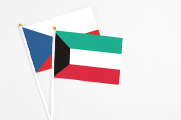 Kuwait and Cyprus stick flags on white background. High quality fabric, miniature national flag. Peaceful global concept.White floor for copy space.