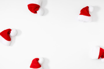 Christmas minimal composition. Santa hat on white background. Christmas, New Year, winter concept. Flat lay, top view, copy space