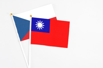 Taiwan and Cyprus stick flags on white background. High quality fabric, miniature national flag. Peaceful global concept.White floor for copy space.