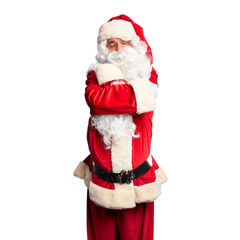 Middle age handsome man wearing Santa Claus costume and beard standing Hugging oneself happy and positive, smiling confident. Self love and self care
