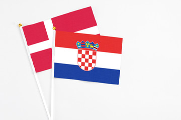 Croatia and Denmark stick flags on white background. High quality fabric, miniature national flag....