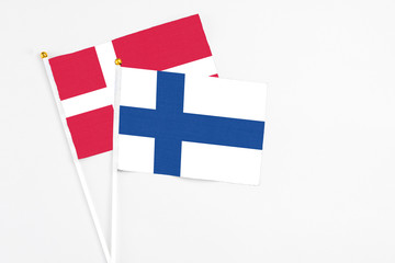 Finland and Denmark stick flags on white background. High quality fabric, miniature national flag....