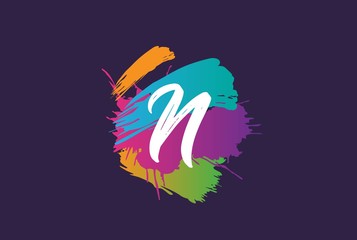 Hand lettering brush initial letter n with colorful paintbrush on dark background template design