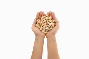 pistachio in hand with white background