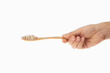 Job's tears in spoon with white background