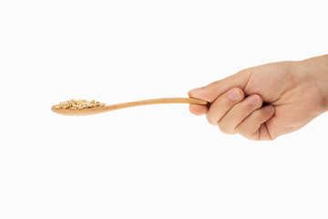 oatmeal in spoon with white background