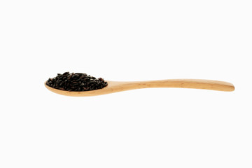 black rice in spoon with white background