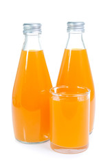 Orange juice in glass bottle isolated on white background