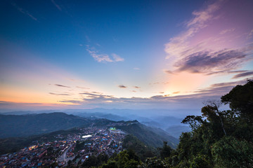 Aerial view of Phongsali, North Laos near China. Yunnan style town on scenic mountain ridge. Travel destination for tribal trekking in Akha villages. Fog and mist in the valley.