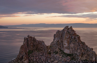 Fototapeta premium Orange sunset on lake Baikal. Shaman Rock. Olkhon Island. Russia.