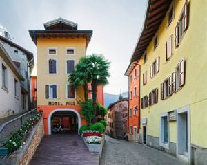 Cityscape and hotel building in Arco town center near Garda lake of Trentino of Italy. Street with house architecture at Old city in Trento near Riva del Garda. Travel and tourism. Cozy landmark.