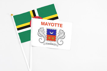 Mayotte and Dominica stick flags on white background. High quality fabric, miniature national flag....