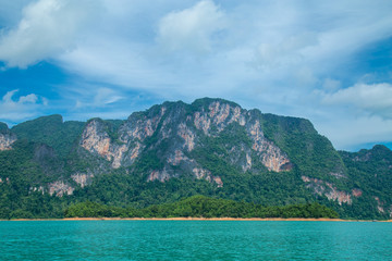 mountains lake river sky and natural attractions in Ratchaprapha Dam at Khao Sok National Park, Surat Thani Province, Thailand.