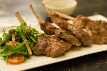 grilled rack of lamb lamb chops with mushroom and salad on the side
