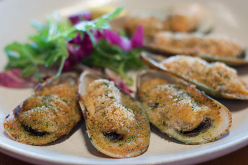 baked green lip mussels with white miso butter, brioche crumbs chives