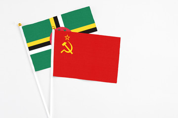 Soviet Union and Dominica stick flags on white background. High quality fabric, miniature national flag. Peaceful global concept.White floor for copy space.