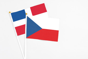 Czech Republic and Dominican Republic stick flags on white background. High quality fabric, miniature national flag. Peaceful global concept.White floor for copy space.