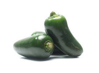 green chilies on white background (jalapeno)
