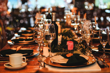 Beautiful dinner table setting. Vintage decoration of reception table. Elegant arrangement of the...