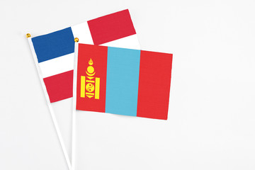Mongolia and Dominican Republic stick flags on white background. High quality fabric, miniature national flag. Peaceful global concept.White floor for copy space.