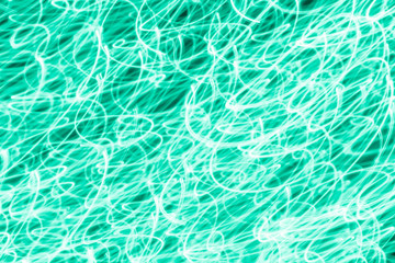 Futuristic blurred lights holiday monochrome background in ocean green. Horizontal, soft focus