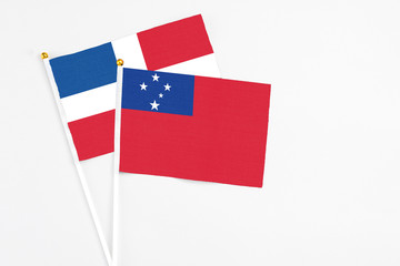 Samoa and Dominican Republic stick flags on white background. High quality fabric, miniature...