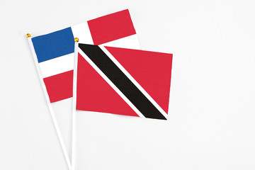 Trinidad And Tobago and Dominican Republic stick flags on white background. High quality fabric,...