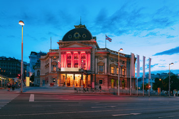 Evening Street view at Volkstheater in Old city center, Vienna, Austria. Cityscape at night in...