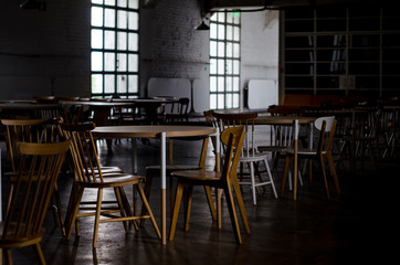 Tables and chairs in low light