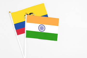 India and Ecuador stick flags on white background. High quality fabric, miniature national flag. Peaceful global concept.White floor for copy space.