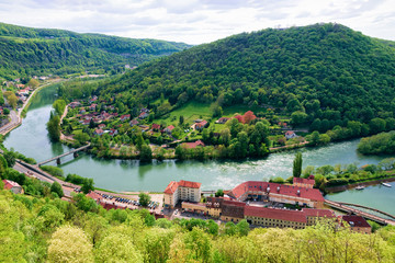 Landscape from Citadel of Besancon with River Doubs in Bourgogne Franche-Comte region, France. French Castle and medieval stone fortress in Burgundy. Fortress architecture and scenery. View from tower - obrazy, fototapety, plakaty