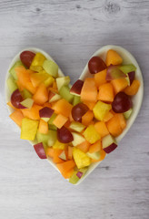 Heart Healthy Fruit Salad on Gray Wood Background