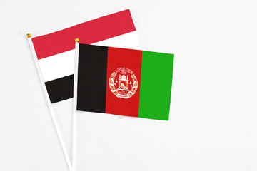Afghanistan and Egypt stick flags on white background. High quality fabric, miniature national...