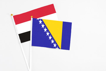Bosnia Herzegovina and Egypt stick flags on white background. High quality fabric, miniature...