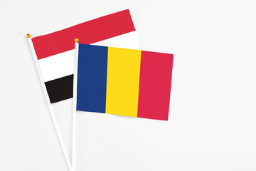 Chad and Egypt stick flags on white background. High quality fabric, miniature national flag....