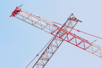 The boom of a construction crane on sky background