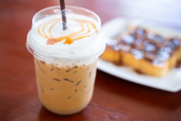 caramel macchiato in plasstic glass