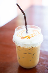 caramel macchiato in plasstic glass