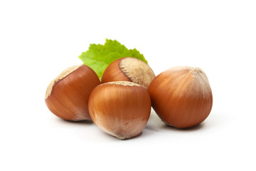 Hazelnut nut many leaves isolated on a white background as a packaging design element